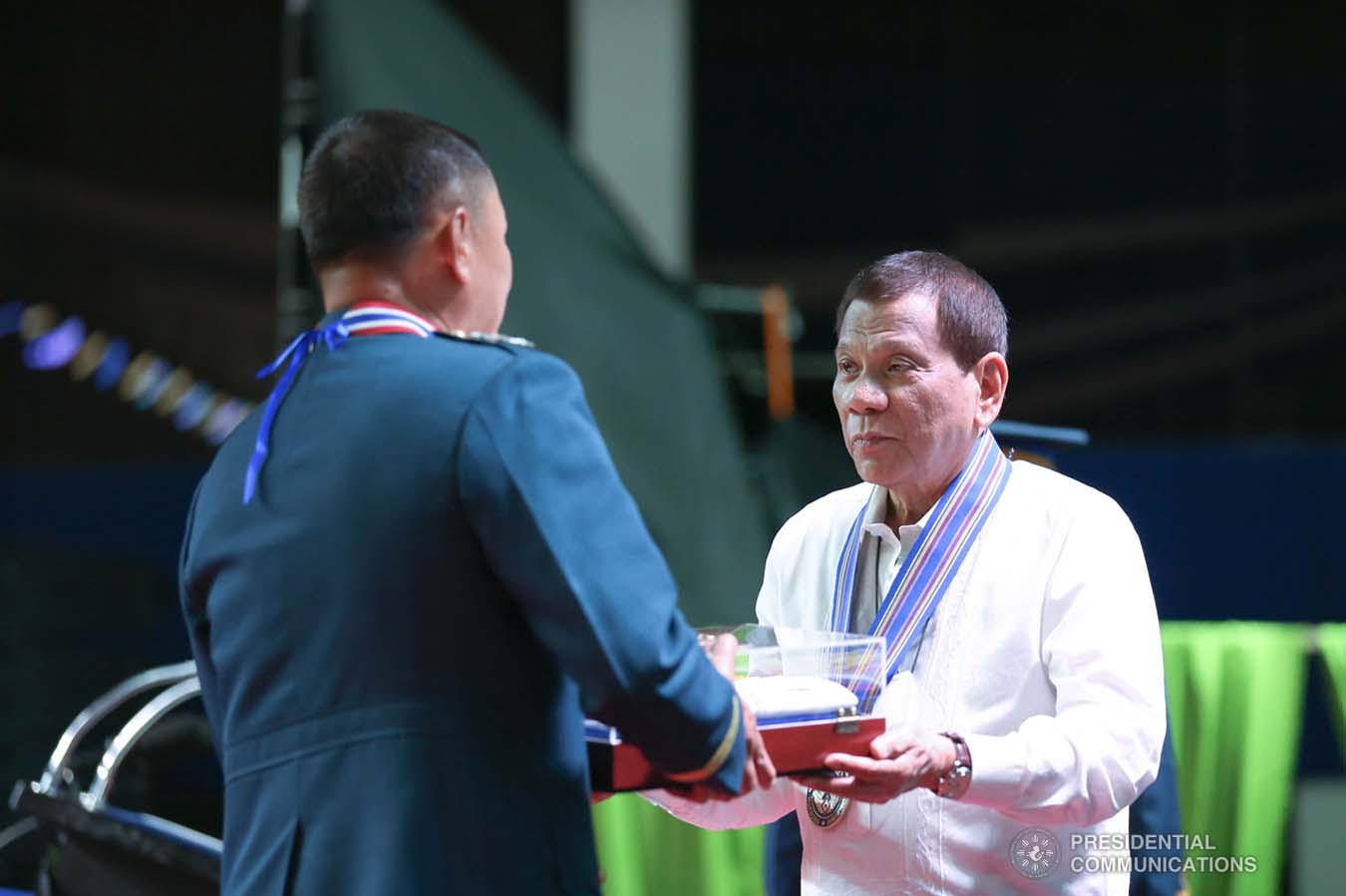 President Rodrigo Roa Duterte hands over an encased Philippine Flag to outgoing Philippine Air Force (PAF) Commanding General Lieutenant General Rozzano Briguez during the PAF Change of Command ceremony at the Col. Jesus Villamor Air Base in Pasay City on January 16, 2020. KARL NORMAN ALONZO/PRESIDENTIAL PHOTO