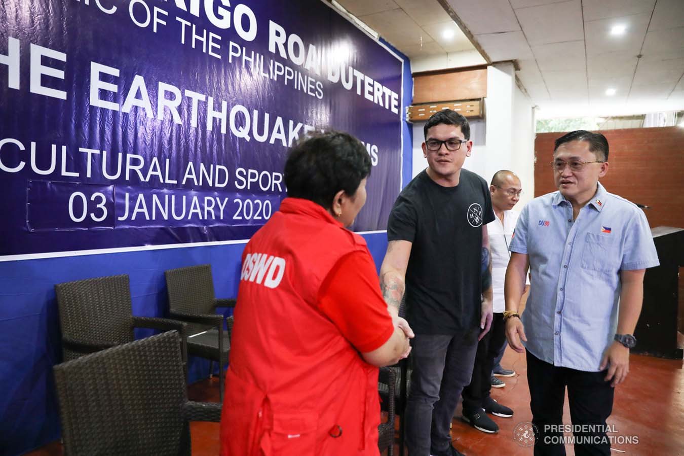 Davao City Vice Mayor Sebastian Duterte, who visited earthquake victims in Malalag, Davao del Sur on behalf of his father President Rodrigo Roa Duterte, greets Social Welfare and Development Undersecretary Luz Ilagan at the Malalag Cultural and Sports Center on January 3, 2020. Also in photo is Senator Christopher "Bong" Go. KARL NORMAN ALONZO/PRESIDENTIAL PHOTO