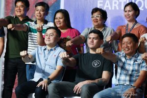 Davao City Vice Mayor Sebastian Duterte, who visited earthquake victims in Padada, Davao del Sur on behalf of his father President Rodrigo Roa Duterte, flashes his father's signature pose with Senator Christopher "Bong" Go, Padada Mayor Pedro Caminero Jr. and other local government officials of Padada at the Padada Central Elementary School on January 3, 2020. RICHARD MADELO/PRESIDENTIAL PHOTO