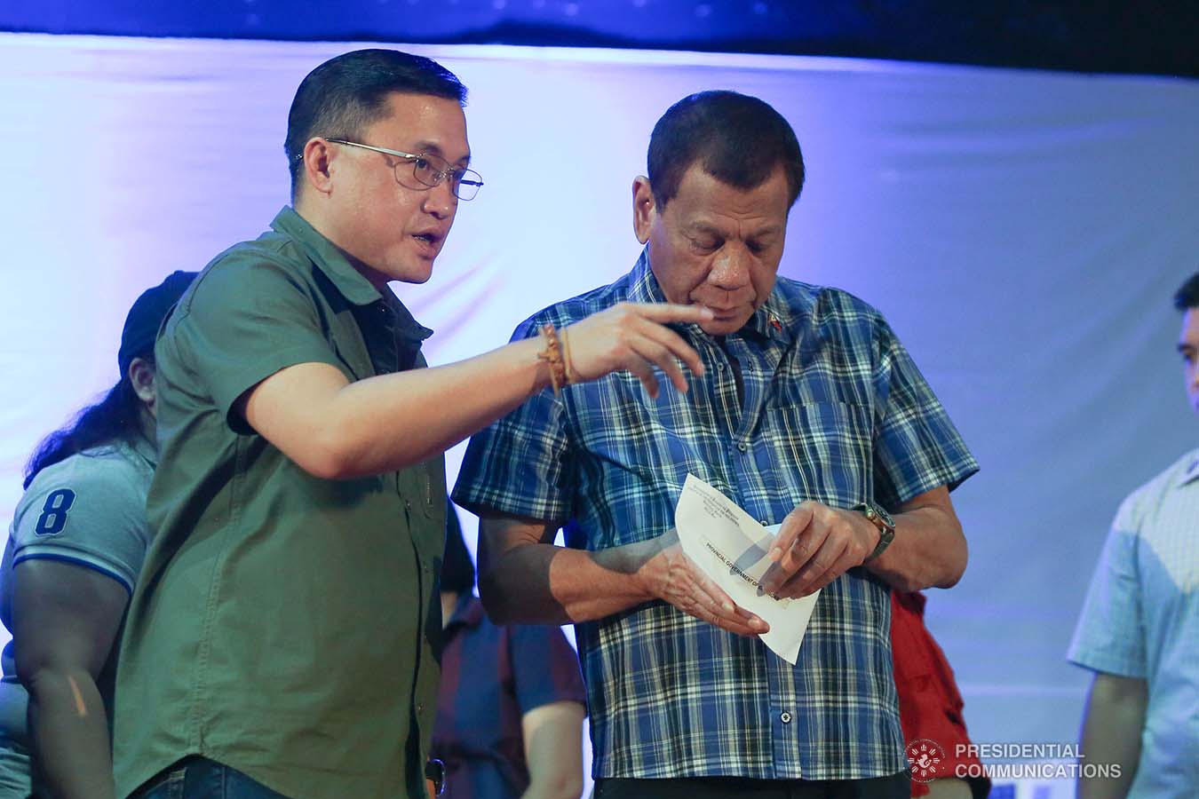 President Rodrigo Roa Duterte prepares to hand over the calamity assistance for the Provincial Government of Batangas during his visit to the families affected by the Taal Volcano eruption at the Polytechnic University of the Philippines-Sto. Tomas Campus in Sto. Tomas City, Batangas on January 20, 2020. With the President is Senator Christopher "Bong" Go. VALERIE ESCALERA/PRESIDENTIAL PHOTO
