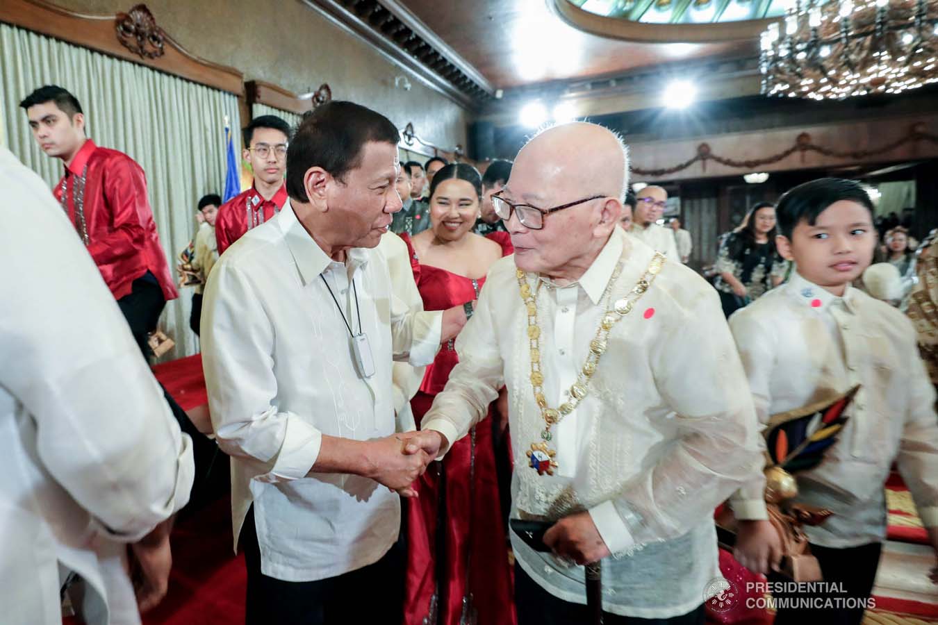 President Rodrigo Roa Duterte shares a light moment with one of the 12th Ani ng Dangal awardees during the presentation of awards at the Malacañan Palace on February 26, 2020. RICHARD MADELO/PRESIDENTIAL PHOTO