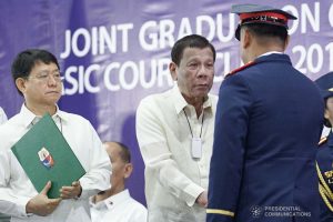 President Rodrigo Roa Duterte congratulates one of the graduates of the Public Safety Officers Basic Course Class 2019-07 and the Public Safety Officers Advance Course Class 2019-18 during a ceremony at the Arcadia Active Lifestyle Center in Davao City on February 20, 2020. ARMAN BAYLON/PRESIDENTIAL PHOTO