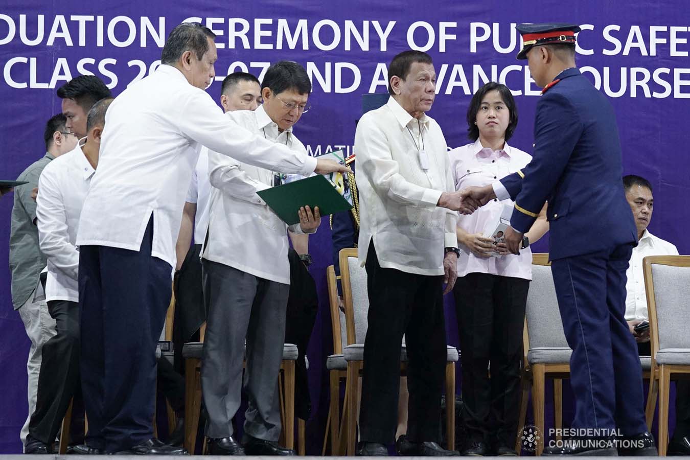 President Rodrigo Roa Duterte congratulates one of the graduates of the Public Safety Officers Basic Course Class 2019-07 and the Public Safety Officers Advance Course Class 2019-18 during a ceremony at the Arcadia Active Lifestyle Center in Davao City on February 20, 2020. ARMAN BAYLON/PRESIDENTIAL PHOTO