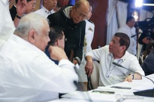 President Rodrigo Roa Duterte confers with Defense Secretary Delfin Lorenzana during a briefing on the 2019 novel Coronavirus (2019-nCoV) at the Malacañan Palace on February 3, 2020. TOTO LOZANO/PRESIDENTIAL PHOTO
