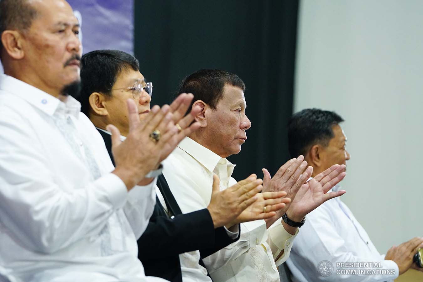 President Rodrigo Roa Duterte applauds while witnessing the program proper during the joint graduation ceremony of Public Safety Officers Basic Course Class 2019-07 and Advance Course Class 2019-18 at the Arcadia Active Lifestyle Center in Davao City on February 20, 2020. JOEY DALUMPINES/PRESIDENTIAL PHOTO