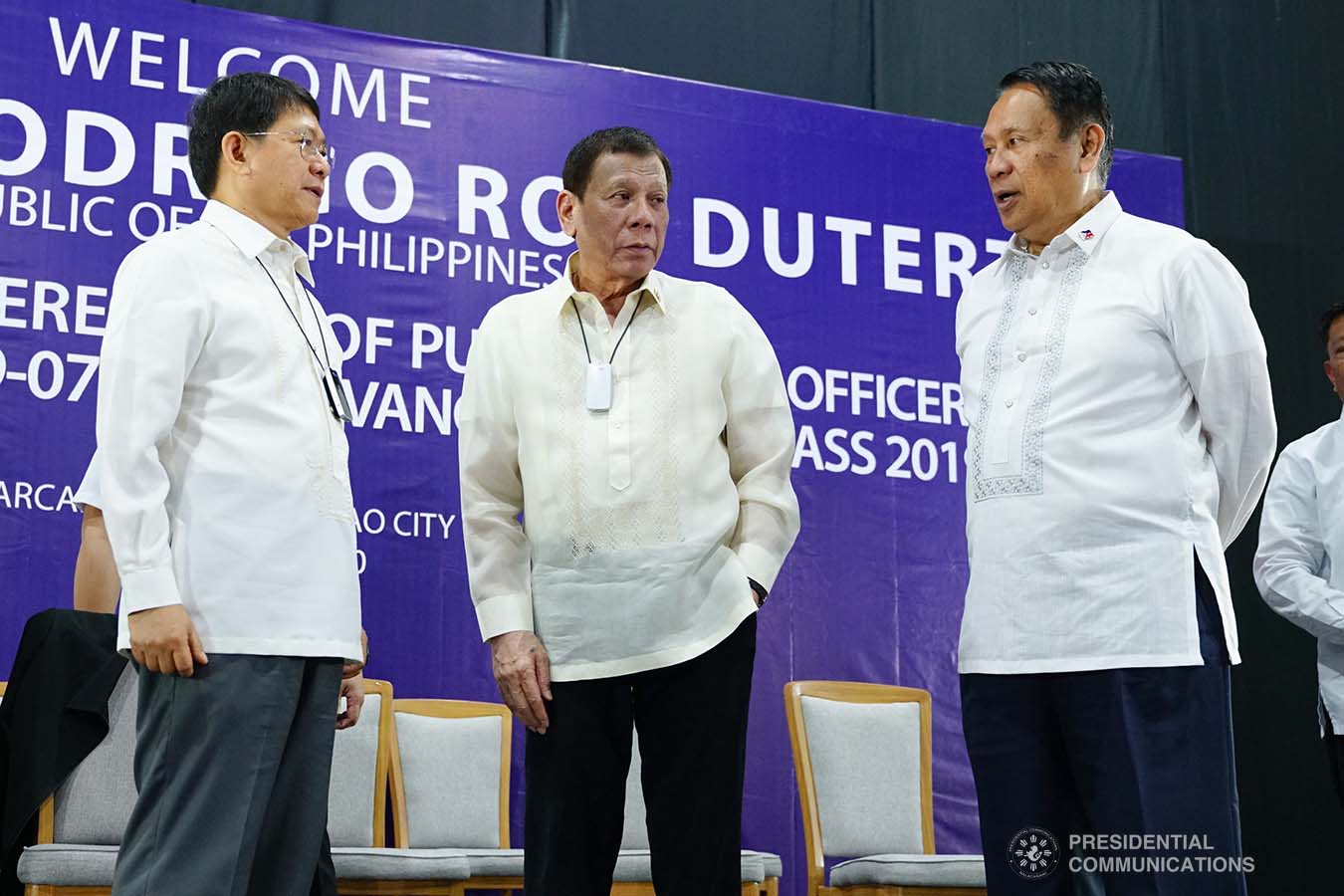 President Rodrigo Roa Duterte chats with Interior and Local Government Secretary Eduardo Año and Philippine Public Safety College President Ricardo De Leon on the sidelines of the joint graduation ceremony of Public Safety Officers Basic Course Class 2019-07 and Advance Course Class 2019-18 at the Arcadia Active Lifestyle Center in Davao City on February 20, 2020. JOEY DALUMPINES/PRESIDENTIAL PHOTO