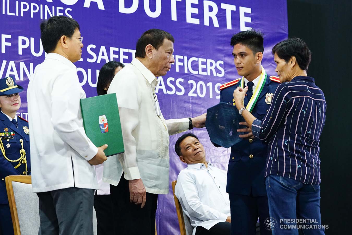 President Rodrigo Roa Duterte congratulates one of the graduates during the joint Public Safety Officers Basic Course Class 2019-07 and Advance Course Class 2019-18 graduation ceremony at the Arcadia Active Lifestyle Center in Davao City on February 20, 2020. JOEY DALUMPINES/PRESIDENTIAL PHOTO