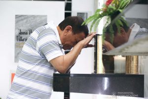 President Rodrigo Roa Duterte takes a solemn moment to commemorate the 52nd death anniversary of his father, Vicente Duterte, at the Roman Catholic Cemetery in Davao City on February 21, 2020. KARL NORMAN ALONZO/PRESIDENTIAL PHOTO