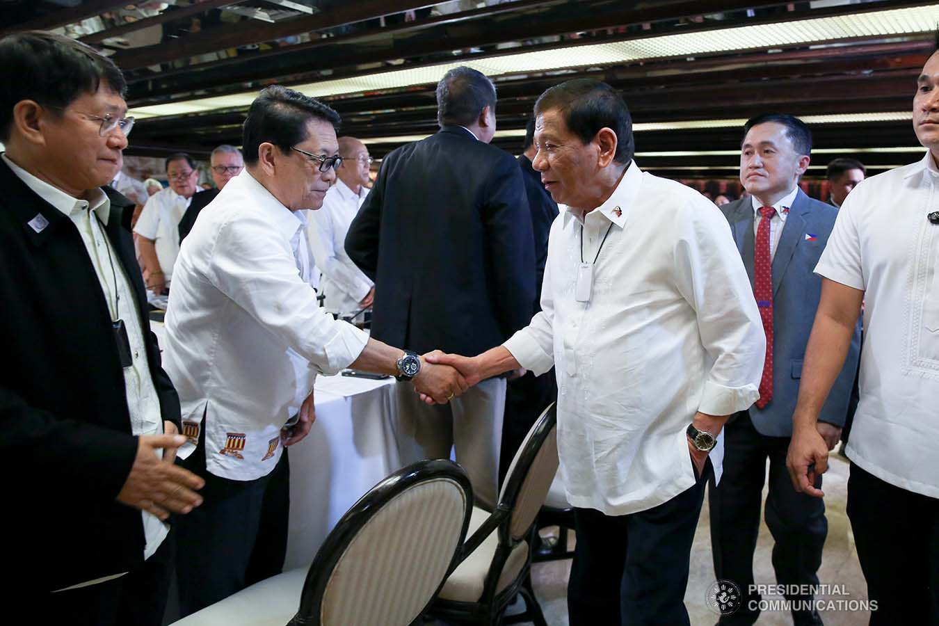 President Rodrigo Roa Duterte greets Labor and Employment Secretary Silvestre Bello III before the start of the meeting with the Inter-Agency Task Force for the Management of Emerging Infectious Diseases at the Malacañan Palace on March 9, 2020.