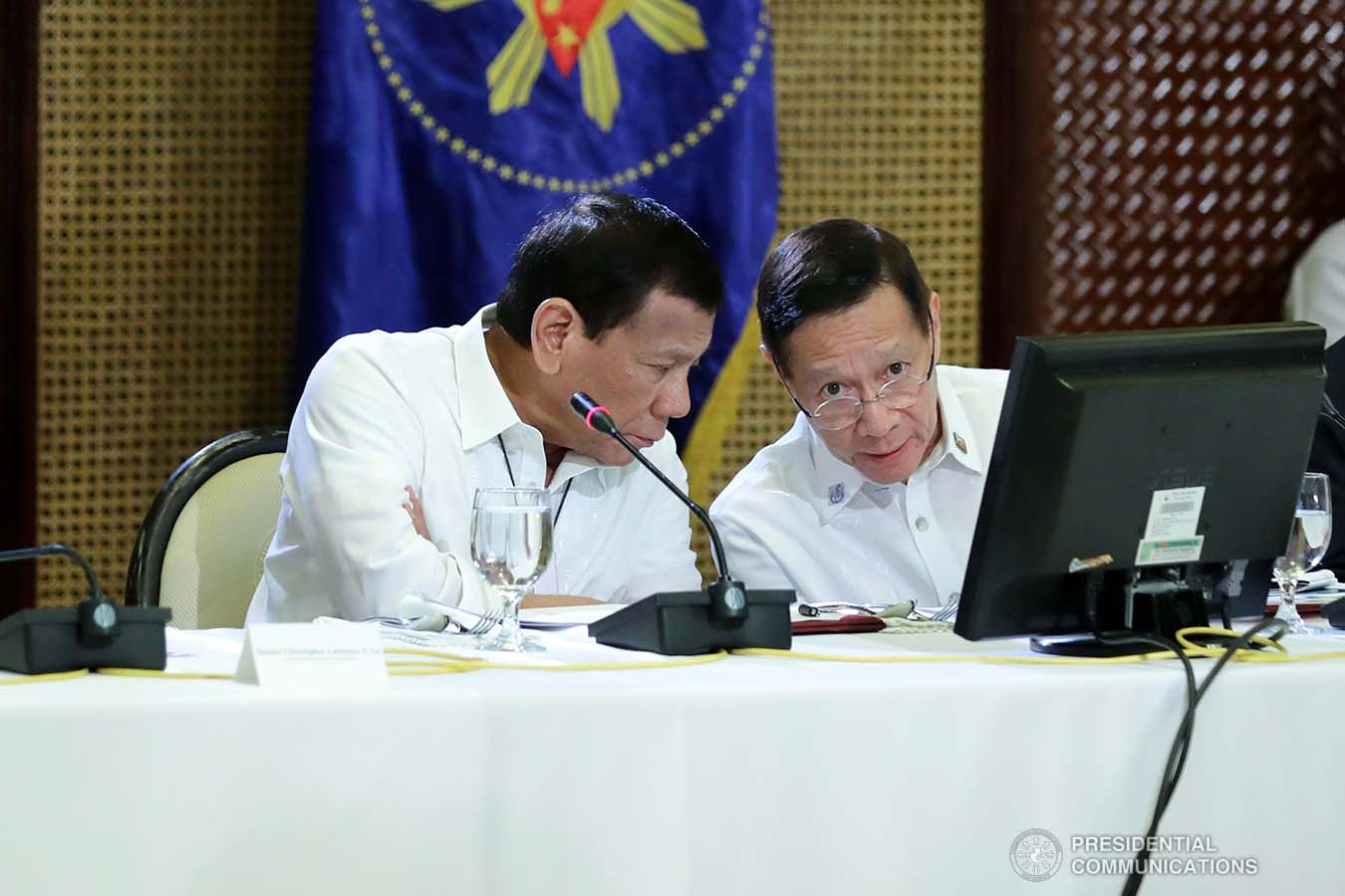 President Rodrigo Roa Duterte confers with Health Secretary Francisco Duque III while holding a meeting with the Inter-Agency Task Force for the Management of Emerging Infectious Diseases at the Malacañan Palace on March 9, 2020.