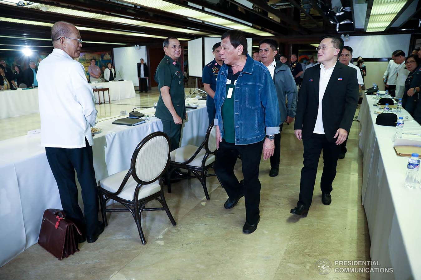 President Rodrigo Roa Duterte greets Defense Secretary Delfin Lorenzana before the start of the meeting with the Inter-Agency Task Force on the Emerging Infectious Diseases (IATF-EID) at the Malacañan Palace on March 12, 2020. SIMEON CELI JR./PRESIDENTIAL PHOTO