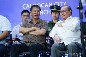 President Rodrigo Roa Duterte shares a light moment with Metro Pacific Investments Corporation Chairman Manuel Pangilinan after leading the inspection of the North Luzon Expressway (NLEX) Harbor Link Circumferential Road 3 (C3)-R10 Section in Caloocan City on March 5, 2020. SIMEON CELI JR./PRESIDENTIAL PHOTO
