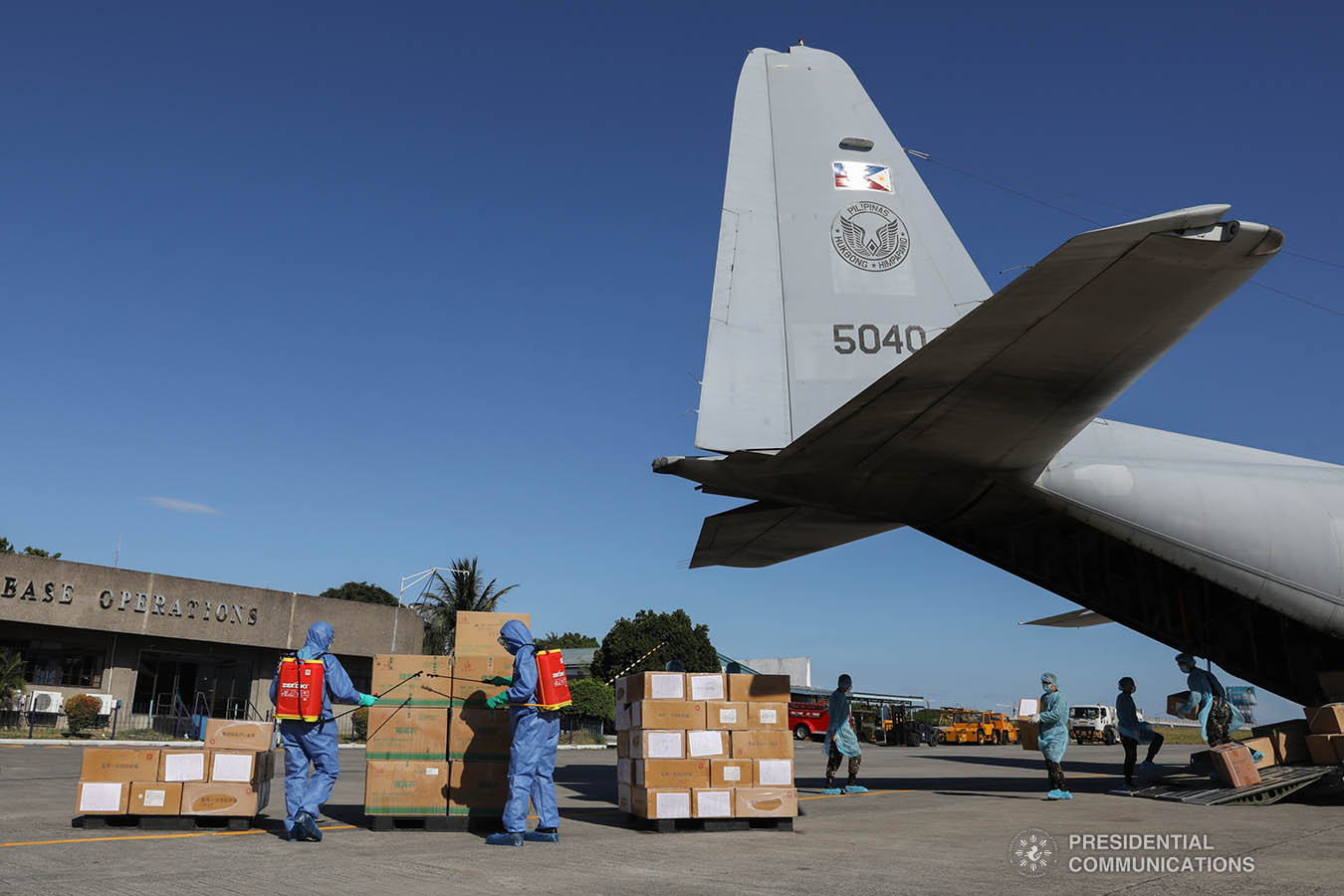 The aid packages donated by the People's Republic of China undergo disinfection upon arrival at the Villamor Air Base in Pasay City on March 21, 2020. The donation includes assorted medical supplies, personal protective equipment, and testing kits for coronavirus. TOTO LOZANO/PRESIDENTIAL PHOTO