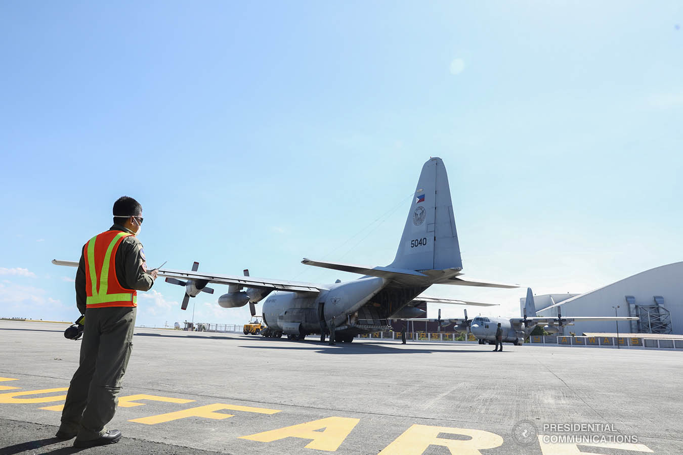 Thousands of aid packages donated by the People's Republic of China are unloaded at the Villamor Air Base in Pasay City on March 21, 2020. The donation includes assorted medical supplies, personal protective equipment, and testing kits for coronavirus. TOTO LOZANO/PRESIDENTIAL PHOTO