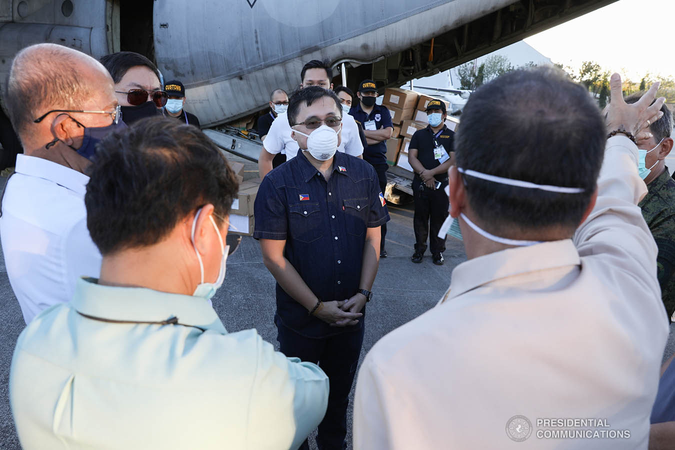 Interior and Local Government Secretary Eduardo Año, Defense Secretary Delfin Lorenzana, Presidential Adviser Carlito Galvez Jr. check the thousands of aid packages donated by the People's Republic of China to help the Philippines combat coronavirus at the Villamor Air Base in Pasay City on March 21, 2020. The donation includes assorted medical supplies, personal protective equipment, and testing kits for coronavirus. Also present was former special assistant to President Duterte and now Senate Committee on Health chairperson Senator Christopher Lawrence "Bong" Go. TOTO LOZANO/PRESIDENTIAL PHOTO