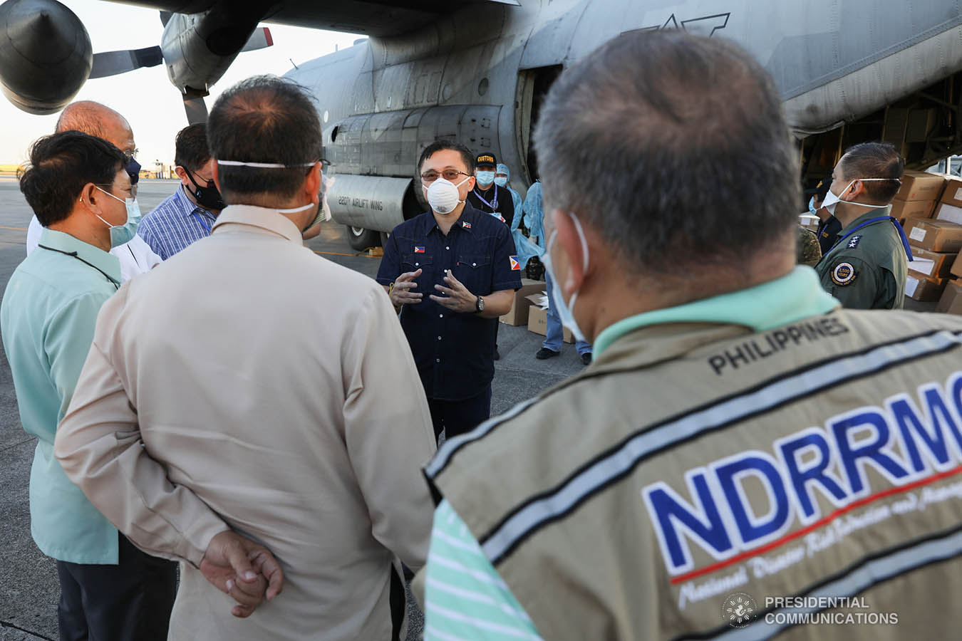 Interior and Local Government Secretary Eduardo Año, Defense Secretary Delfin Lorenzana, Presidential Adviser Carlito Galvez Jr. check the thousands of aid packages donated by the People's Republic of China to help the Philippines combat coronavirus at the Villamor Air Base in Pasay City on March 21, 2020. The donation includes assorted medical supplies, personal protective equipment, and testing kits for coronavirus. Also present was former special assistant to President Duterte and now Senate Committee on Health chairperson Senator Christopher Lawrence "Bong" Go. TOTO LOZANO/PRESIDENTIAL PHOTO
