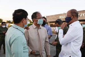 Interior and Local Government Secretary Eduardo Año, Defense Secretary Delfin Lorenzana, Presidential Adviser Carlito Galvez Jr. check the thousands of aid packages donated by the People's Republic of China to help the Philippines combat coronavirus at the Villamor Air Base in Pasay City on March 21, 2020. The donation includes assorted medical supplies, personal protective equipment, and testing kits for coronavirus. Also present was former special assistant to President Duterte and now Senate Committee on Health chairperson Senator Christopher Lawrence "Bong" Go. TOTO LOZANO/PRESIDENTIAL PHOTO