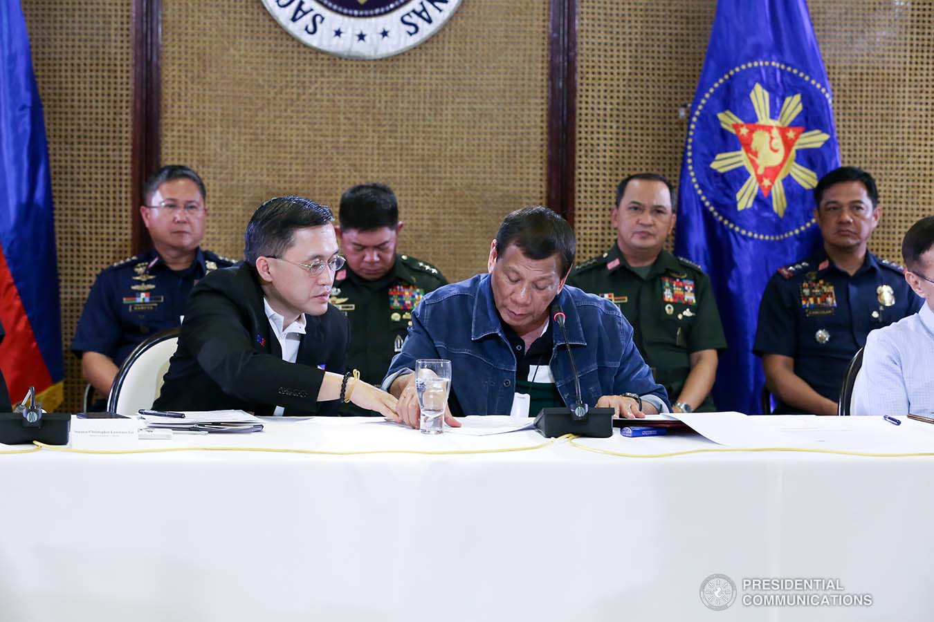 President Rodrigo Roa Duterte confers with Senator Christopher "Bong" Go during the meeting with the Inter-Agency Task Force on the Emerging Infectious Diseases (IATF-EID) at the Malacañan Palace on March 12, 2020. RICHARD MADELO/PRESIDENTIAL PHOTO