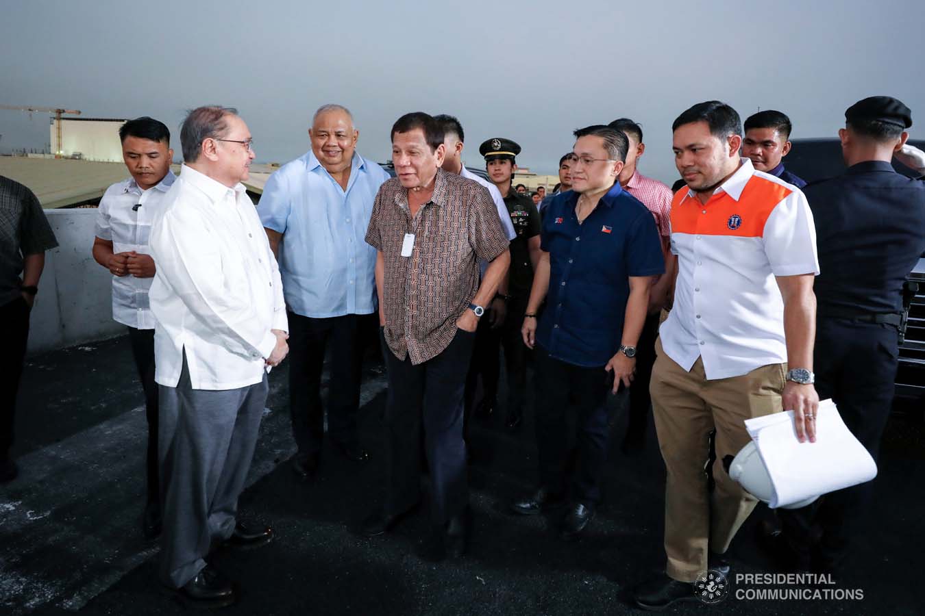 President Rodrigo Roa Duterte shares a light moment with Metro Pacific Investments Corporation Chairman Manuel Pangilinan while leading the inspection of the North Luzon Expressway (NLEX) Harbor Link Circumferential Road 3 (C3)-R10 Section in Caloocan City on March 5, 2020. RICHARD MADELO/PRESIDENTIAL PHOTO