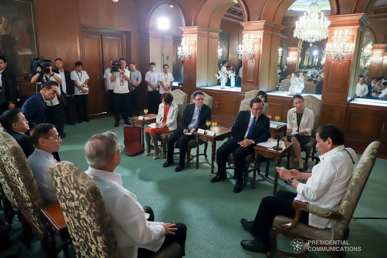 President Rodrigo Roa Duterte reads a document while discussing matters with Ambassador of the People's Republic of China to the Philippines Huang Xilian who paid a courtesy call on the President at the Malacañan Palace on March 11, 2020. REY BANIQUET/PRESIDENTIAL PHOTO