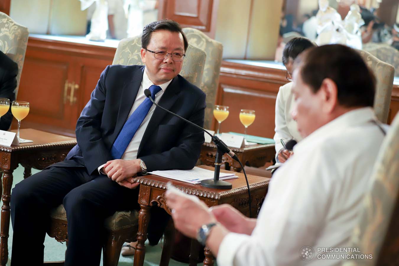 President Rodrigo Roa Duterte reads a document while discussing matters with Ambassador of the People's Republic of China to the Philippines Huang Xilian who paid a courtesy call on the President at the Malacañan Palace on March 11, 2020. REY BANIQUET/PRESIDENTIAL PHOTO