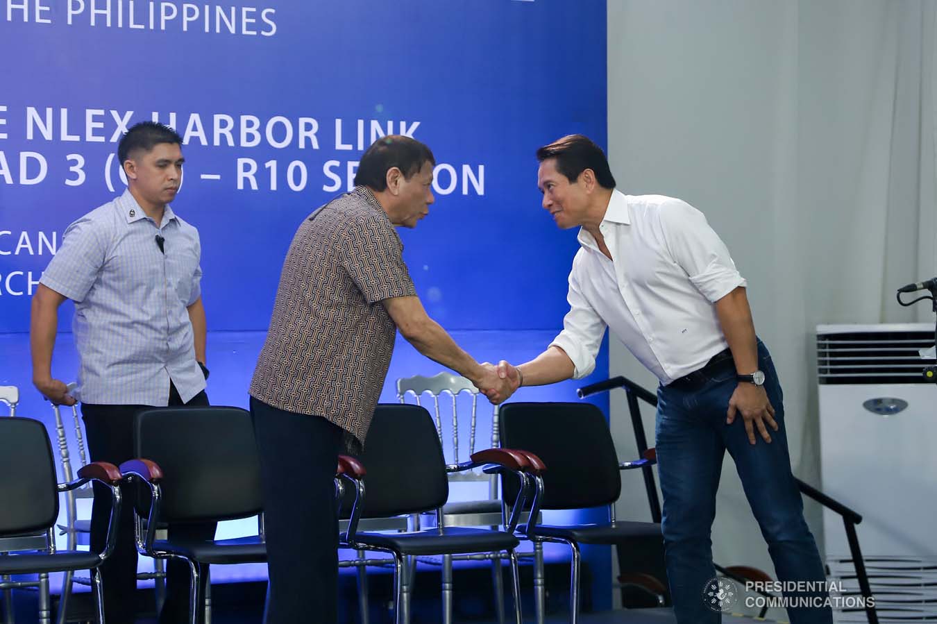 President Rodrigo Roa Duterte greets one of the distinguished guests during the inspection of the North Luzon Expressway (NLEX) Harbor Link Circumferential Road 3 (C3)-R10 Section in Caloocan City on March 5, 2020. VALERIE ESCALERA/PRESIDENTIAL PHOTO