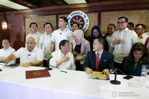 President Rodrigo Roa Duterte shares a light moment with one of the guests during the meeting at the Malacañan Palace on March 4, 2020. ALFRED FRIAS/PRESIDENTIAL PHOTO