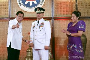 President Rodrigo Roa Duterte shares a light moment with Philippine Air Force Commanding General Lieutenant General Allen Paredes during the oath-taking ceremony of the newly appointed Generals and Flag Officers of the Armed Forces of the Philippines and Star Rank Officers of the Philippine National Police at the Malacañan Palace on March 11, 2020. ROBINSON NIÑAL JR./PRESIDENTIAL PHOTO