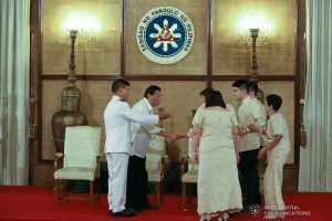 President Rodrigo Roa Duterte greets the family of one of the generals who took oath before the President at the Malacañan Palace on March 11, 2020. REY BANIQUET/PRESIDENTIAL PHOTO