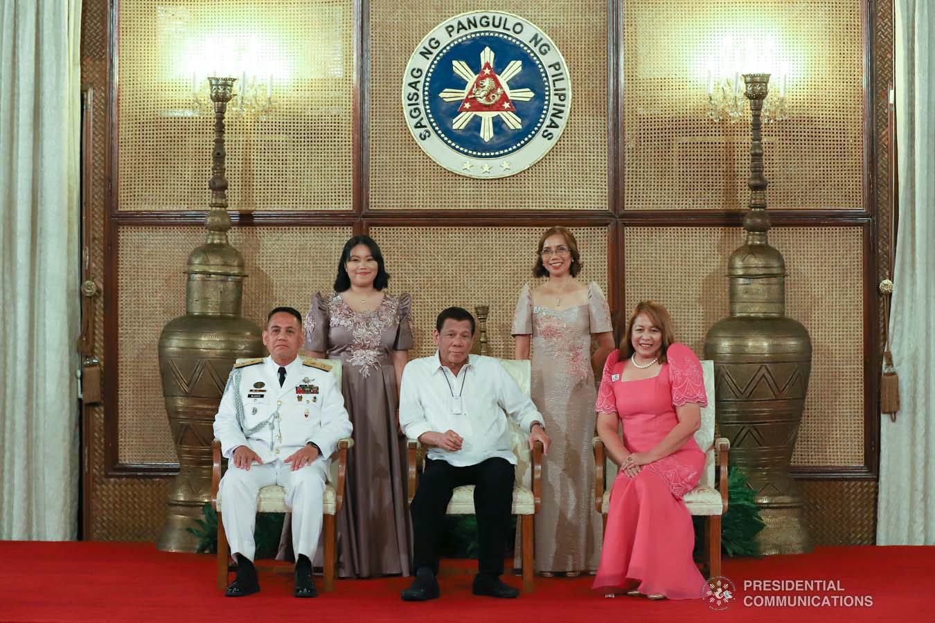 President Rodrigo Roa Duterte poses for posterity with Brigadier General George Blanco and his family during the oath-taking ceremony of the newly appointed Generals and Flag Officers of the Armed Forces of the Philippines and Star Rank Officers of the Philippine National Police at the Malacañan Palace on March 11, 2020. REY BANIQIUET/PRESIDENTIAL PHOTO