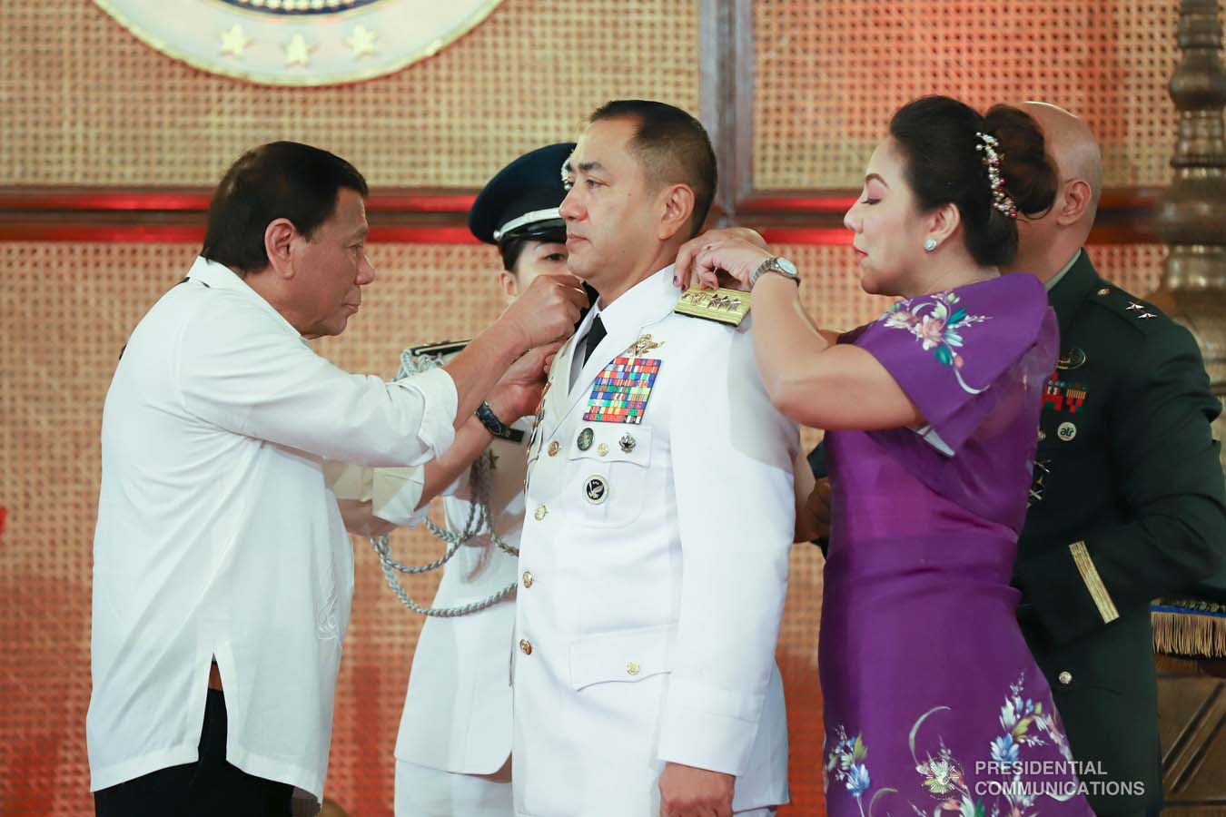 President Rodrigo Roa Duterte pins the rank insignia on Philippine Air Force chief Lieutenant General Allen Paredes during the oath-taking ceremony of the newly appointed Generals and Flag Officers of the Armed Forces of the Philippines and Star Rank Officers of the Philippine National Police at the Malacañan Palace on March 11, 2020. REY BANIQUET/PRESIDENTIAL PHOTO