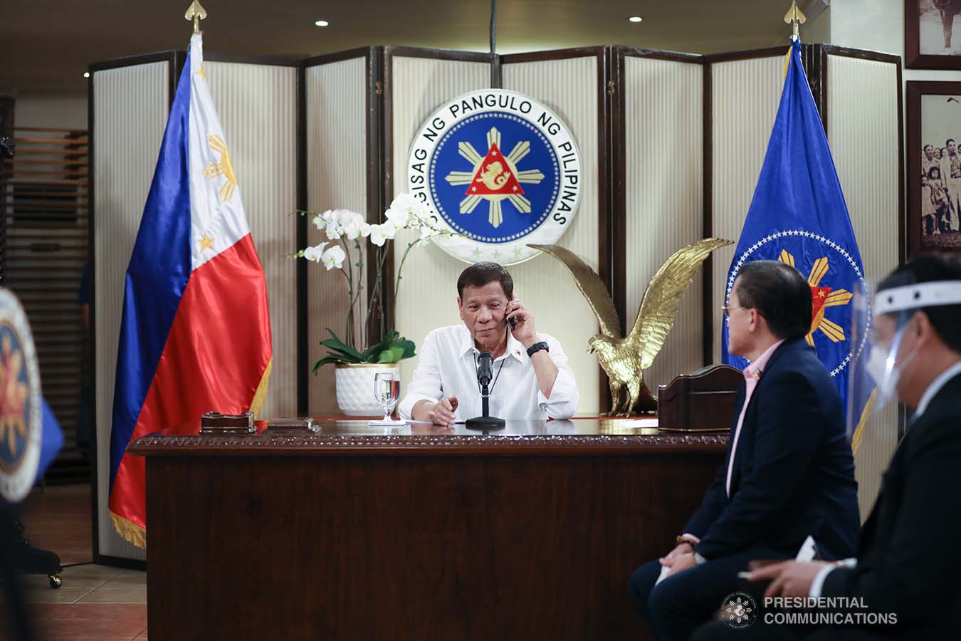 President Rodrigo Roa Duterte talks on the phone with Socialist Republic of Vietnam Prime Minister Nguyen Phuc at the Malago Clubhouse in Malacañang, Manila on May 26, 2020. KARL NORMAN ALONZO/PRESIDENTIAL PHOTO