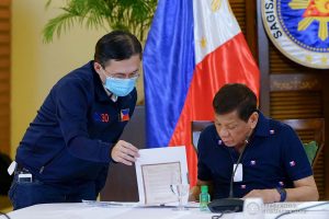 President Rodrigo Roa Duterte reviews a document during a meeting with members of the Inter-Agency Task Force on the Emerging Infectious Diseases (IATF-EID) at the Matina Enclaves in Davao City on June 4, 2020. JOEY DALUMPINES/PRESIDENTIAL PHOTO