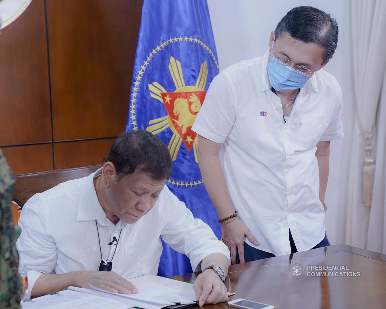 President Rodrigo Roa Duterte signs into law the establishment of the National Academy of Sports during a ceremony at the Presidential Guest House in Panacan, Davao City on June 9, 2020. With the President is Senator Christopher "Bong" Go. ARMAN BAYLON/PRESIDENTIAL PHOTO