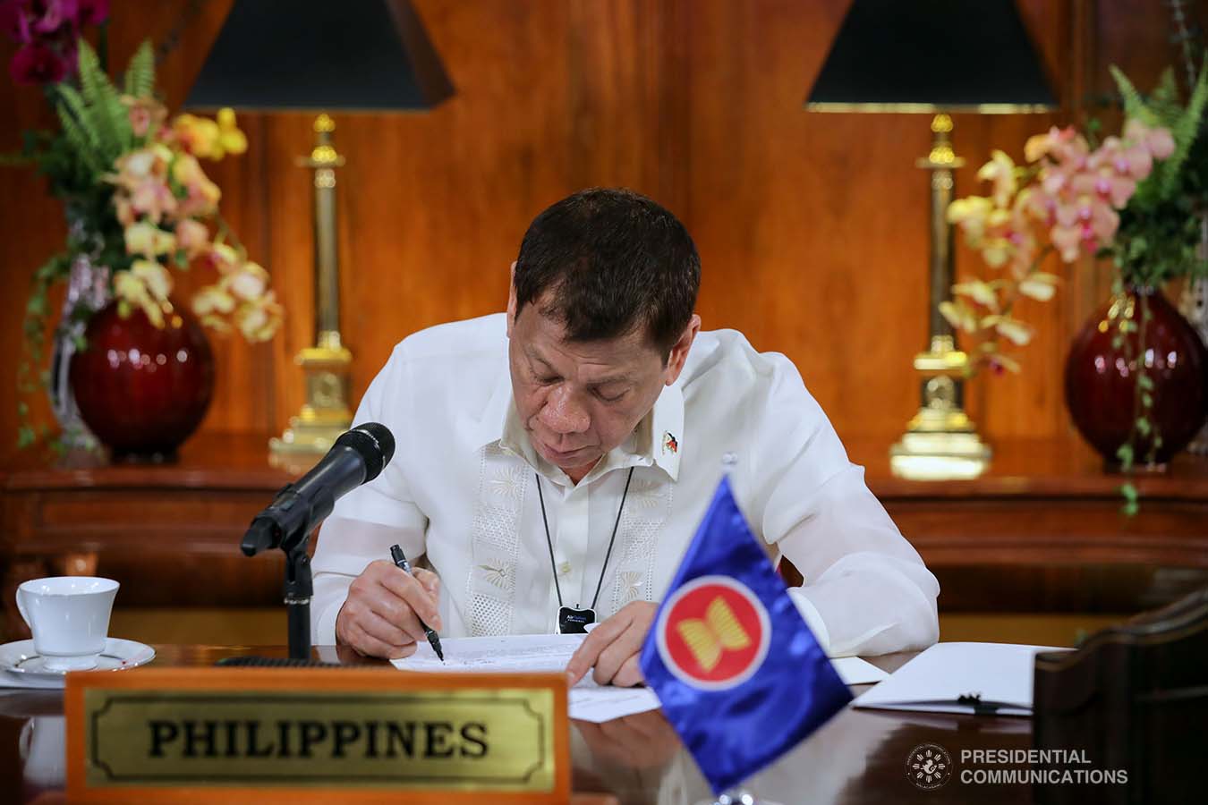 President Rodrigo Roa Duterte reviews a document as he joins other leaders from the Association of Southeast Asian Nations (ASEAN) member countries during the 36th ASEAN Summit video conference at the Malago Clubhouse in Malacañang on June 26, 2020. ROBINSON NIÑAL JR./PRESIDENTIAL PHOTOS