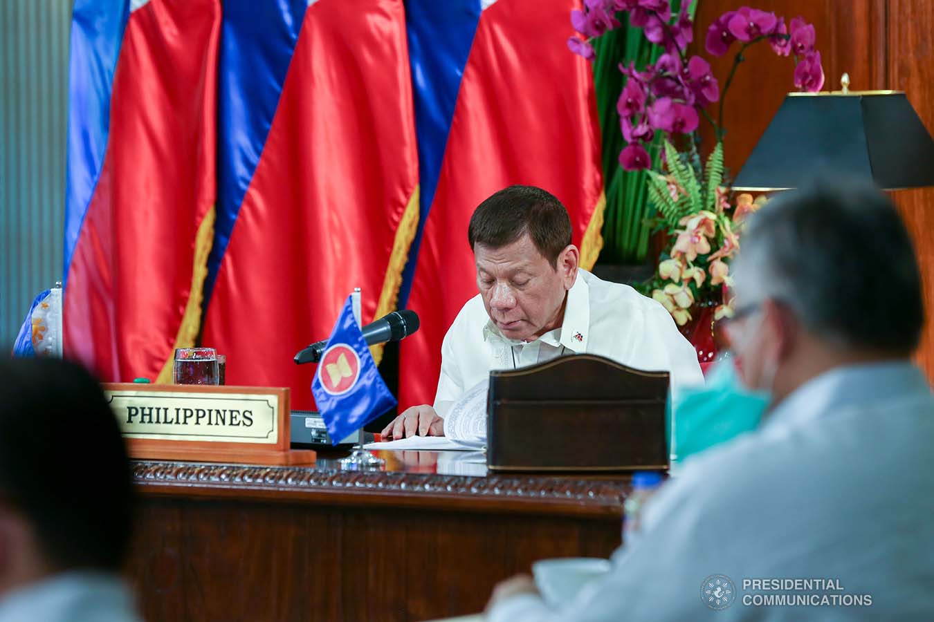 President Rodrigo Roa Duterte reviews a document as he joins other leaders from the Association of Southeast Asian Nations (ASEAN) member countries during the 36th ASEAN Summit video conference at the Malago Clubhouse in Malacañang on June 26, 2020. SIMEON CELI JR./PRESIDENTIAL PHOTOS