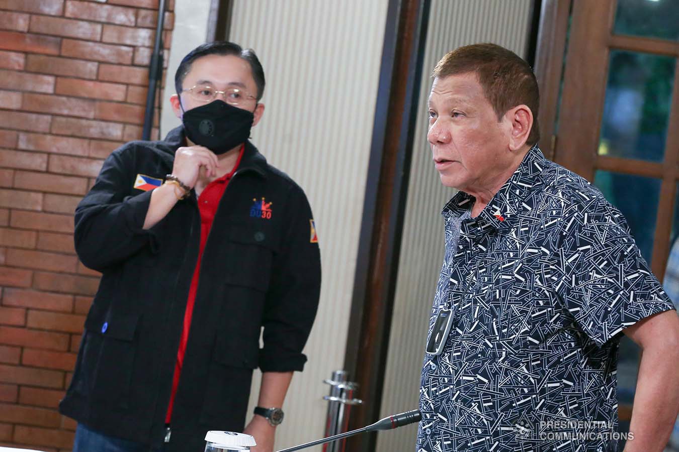 President Rodrigo Roa Duterte chats with Senator Christopher "Bong" Go on the sidelines of the meeting with the Task Force on the Emerging Infectious Diseases (IATF-EID) core members at the Malago Clubhouse in Malacañang on June 30, 2020. ALBERT ALCAIN/PRESIDENTIAL PHOTO