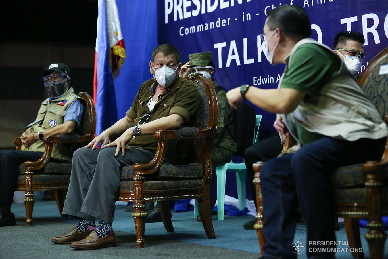 President Rodrigo Roa Duterte confers with Senator Christopher "Bong" Go during his visit to the Edwin Andrews Air Base in Zamboanga City on July 3, 2020. SIMEON CELI JR. JR./PRESIDENTIAL PHOTO