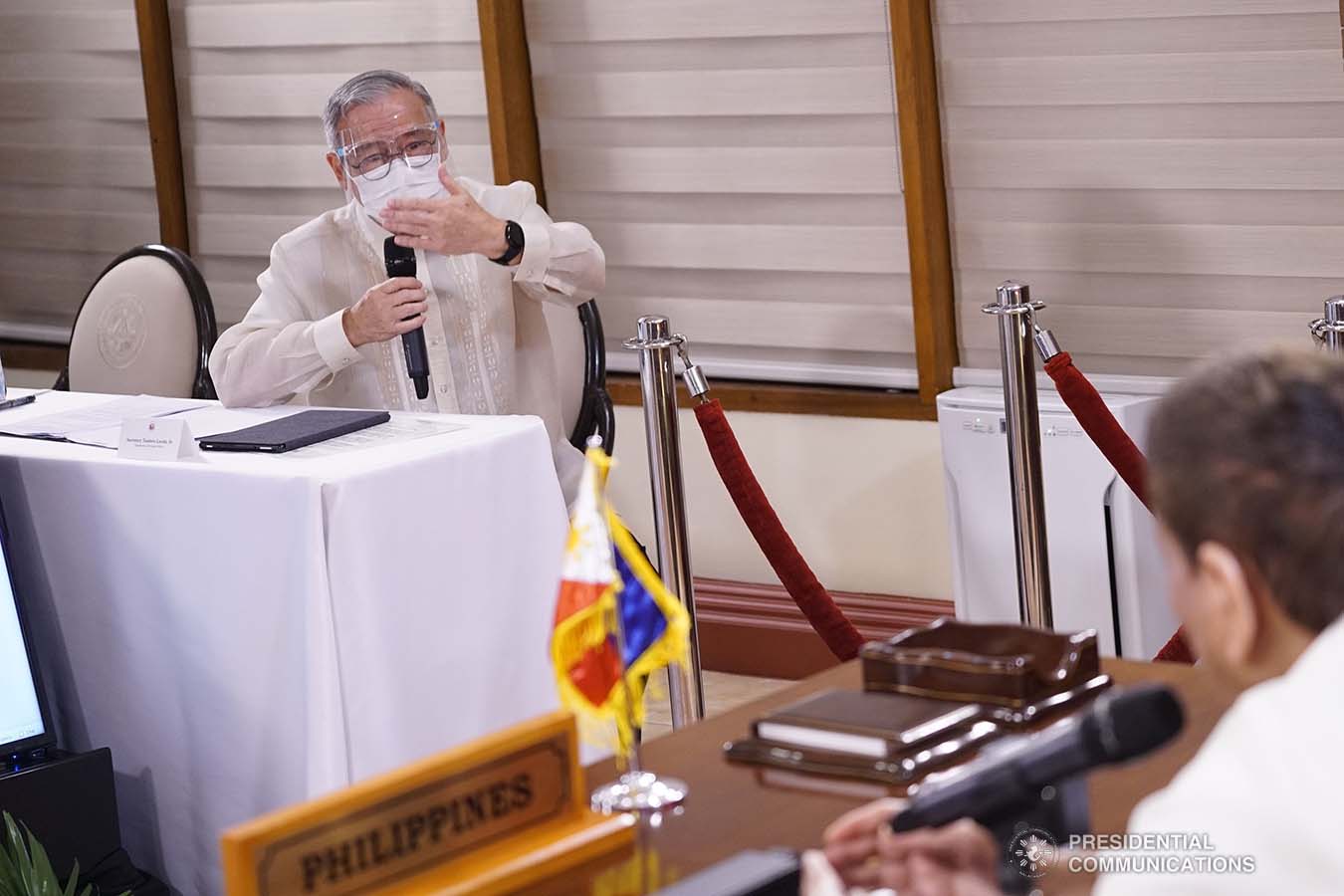 President Rodrigo Roa Duterte discusses matters with Foreign Affairs Secretary Teodoro Locsin Jr. following the Aqaba Process video conference at the Malago Clubhouse in Malacañang on September 2, 2020. KING RODRIGUEZ/PRESIDENTIAL PHOTOS