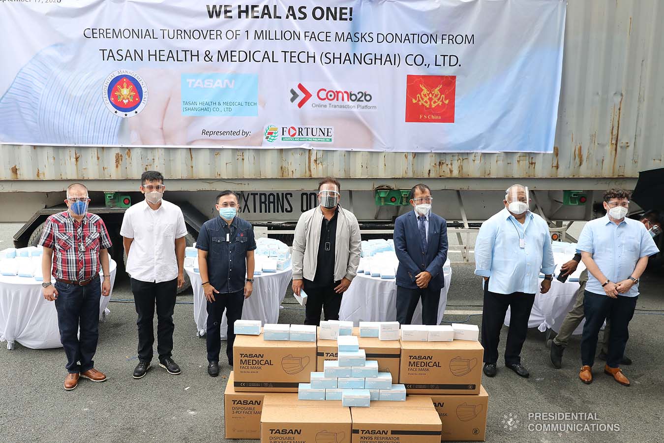 Executive Secretary Salvador Medialdea and Senator Christopher Go pose for posterity with Fortune Logistics and Marketing Philippines and other officials during the ceremonial turnover of the one million face masks donated by Tasan Health and Medical Tech (Shanghai) Company Limited at the Rizal Park Hotel in Manila on September 17, 2020. The face masks will help the government in combating COVID-19. REY BANIQUET/ PRESIDENTIAL PHOTOS