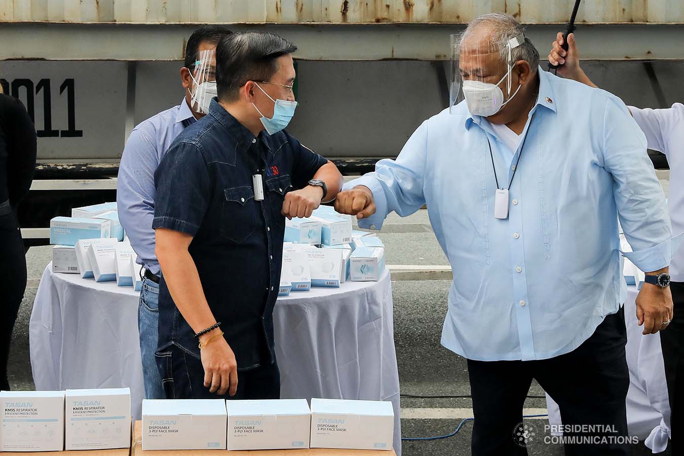 Executive Secretary Salvador Medialdea and Senator Christopher Go greet each other upon their arrival at the Rizal Park Hotel in Manila during the ceremonial turnover of the one million face masks donated by Tasan Health and Medical Tech (Shanghai) Company Limited on September 17, 2020. REY BANIQUET/ PRESIDENTIAL PHOTOS