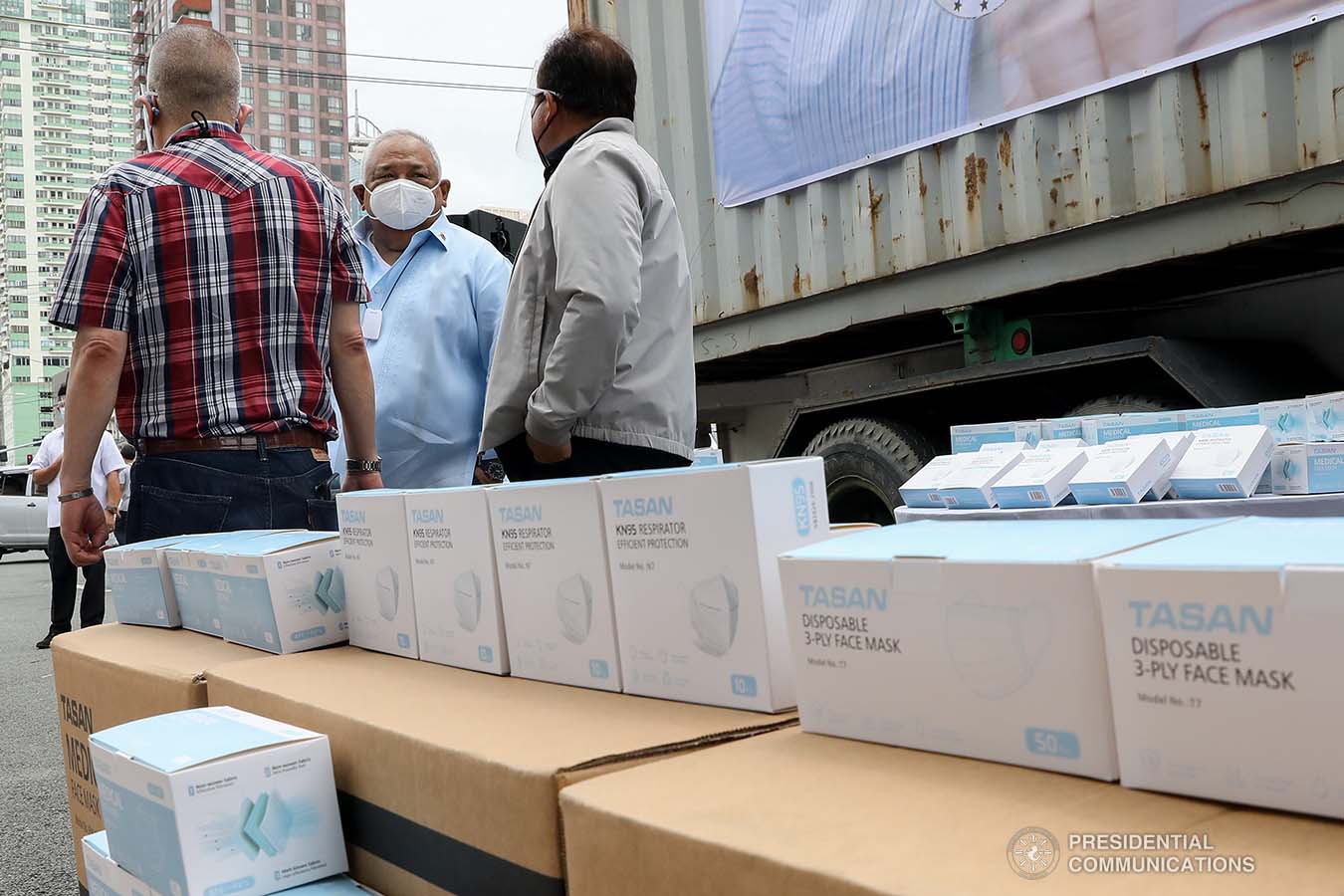 Executive Secretary Salvador Medialdea inspects some of the face masks donated by Tasan Health and Medical Tech (Shanghai) Company Limited prior to the start of the ceremonial turnover at the Rizal Park Hotel in Manila on September 17, 2020. REY BANIQUET/ PRESIDENTIAL PHOTOS