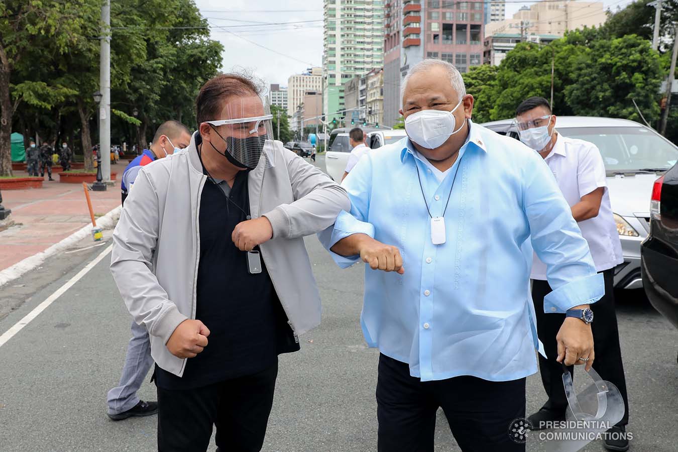 Executive Secretary Salvador Medialdea and Philippine Postal Corporation Chairman Norman Fulgencio  greet each other upon their arrival at the Rizal Park Hotel in Manila during the ceremonial turnover of the one million face masks donated by Tasan Health and Medical Tech (Shanghai) Company Limited on September 17, 2020. REY BANIQUET/ PRESIDENTIAL PHOTOS