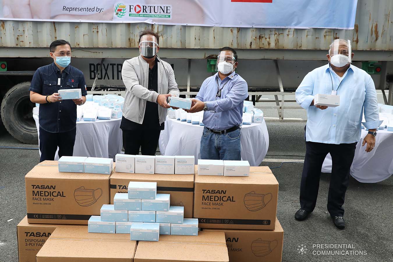 Executive Secretary Salvador Medialdea and Senator Christopher Go witness the ceremonial turnover of one million face masks between Philippine Postal Corporation Chairman Norman Fulgencio and Presidential Management Staff Assistant Secretary Joseph Encabo at the Rizal Park Hotel in Manila on September 17, 2020. REY BANIQUET/ PRESIDENTIAL PHOTOS