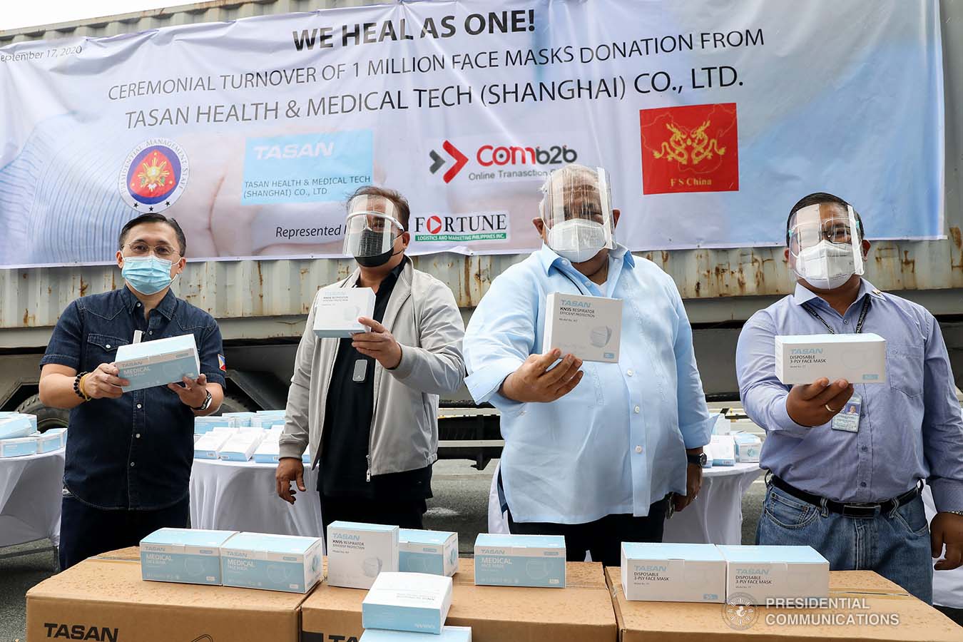 Executive Secretary Salvador Medialdea and Senator Christopher Go pose for posterity with Fortune Logistics and Marketing Philippines and other officials during the ceremonial turnover of the one million face masks donated by Tasan Health and Medical Tech (Shanghai) Company Limited at the Rizal Park Hotel in Manila on September 17, 2020. The face masks will help the government in combating COVID-19. REY BANIQUET/ PRESIDENTIAL PHOTOS