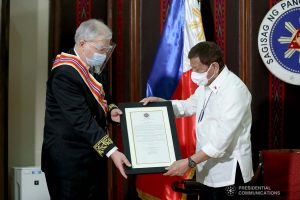 President Rodrigo Roa Duterte confers the Order of Sikatuna on outgoing Ambassador of the Russian Federation to the Philippines Igor Khovaev who paid a farewell call on the President at the Malacañang Golf (Malago) Clubhouse in Malacañang Park, Manila on October 14, 2020. RICHARD MADELO/ PRESIDENTIAL PHOTO