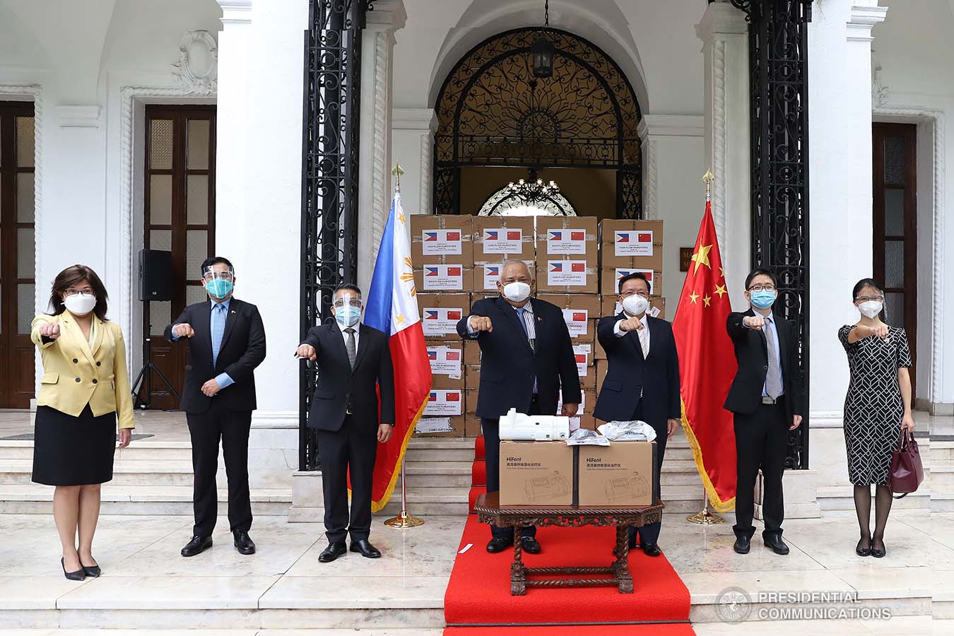 Executive Secretary Salvador Medialdea and Chinese Ambassador to the Philippines Huang Xilian pose for prosperity following the ceremonial turnover of 150 units of High-Flow Nasal Cannula Oxygen Therapy equipment with 300 sets of accessories  at the Kalayaan in Malacañan Palace on October 21, 2020. Joining them are Presidential Assistant on Foreign Affairs and Chief of Presidential Protocol Robert E.A. Borje and representatives from the Department on Foreign Affairs, and the Department of Health. The humidifiers donated by Chinese Embassy in the Philippines will help ramp up the capacities of Philippine public hospitals and facilities in providing treatment to COVID-19 patients. The assistance forms part of the Philippines-China partnership in addressing the global challenges brought by the COVID-19 pandemic. VALERIE ESCALERA/ PRESIDENTIAL PHOTO