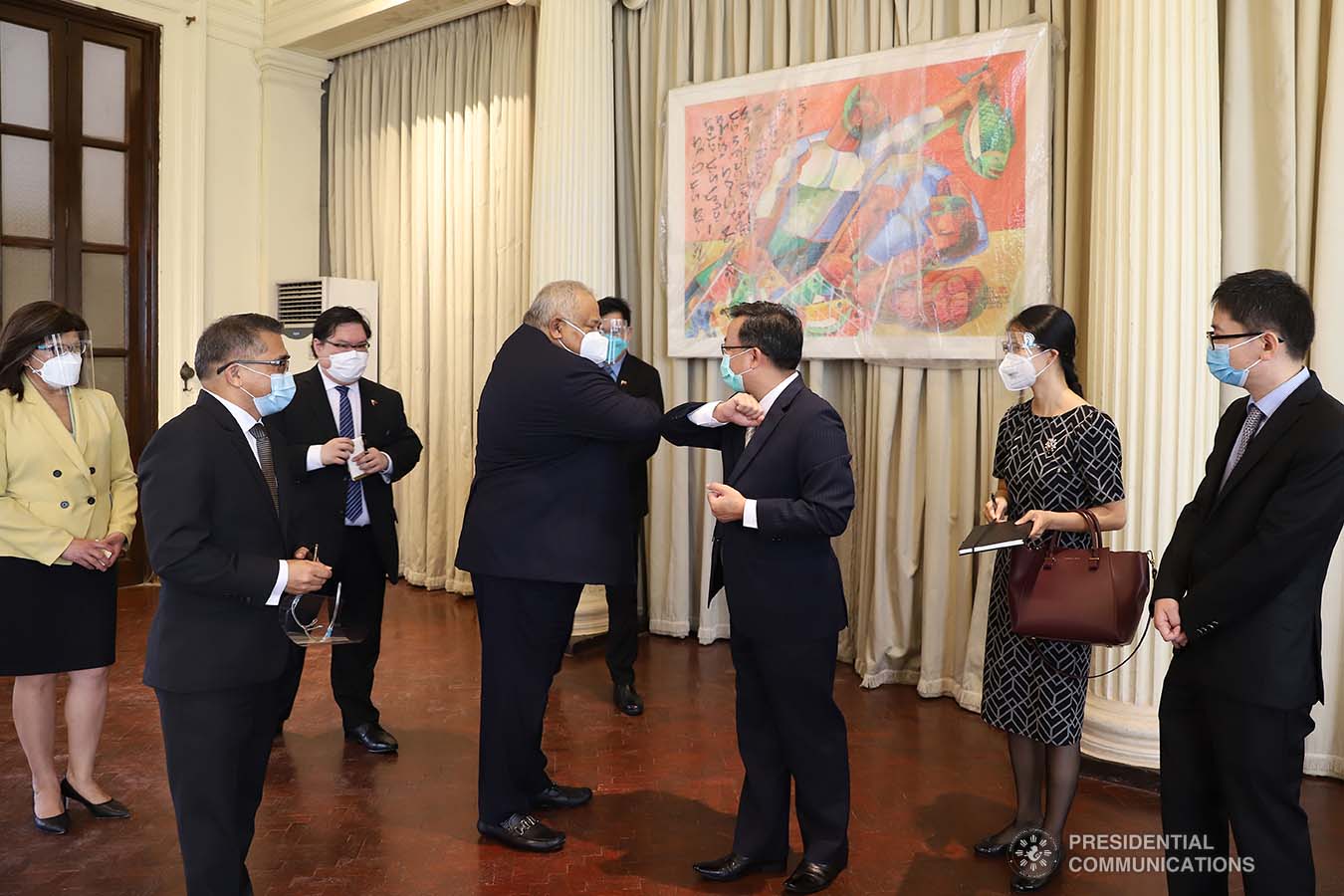 Executive Secretary Salvador Medialdea greets Chinese Ambassador to the Philippines Huang Xilian upon the latter's arrival at the Kalayaan Hall in Malacañan Palace for the ceremonial turnover of 150 units of High-Flow Nasal Cannula Oxygen Therapy equipment with 300 sets of accessories on October 21, 2020. The humidifiers donated by the Chinese Embassy in the Philippines will help ramp up the capacities of Philippine public hospitals and facilities in providing treatment to COVID-19 patients. The assistance forms part of the Philippines-China partnership in addressing the global challenges brought by the COVID-19 pandemic. VALERIE ESCALERA/PRESIDENTIAL PHOTO