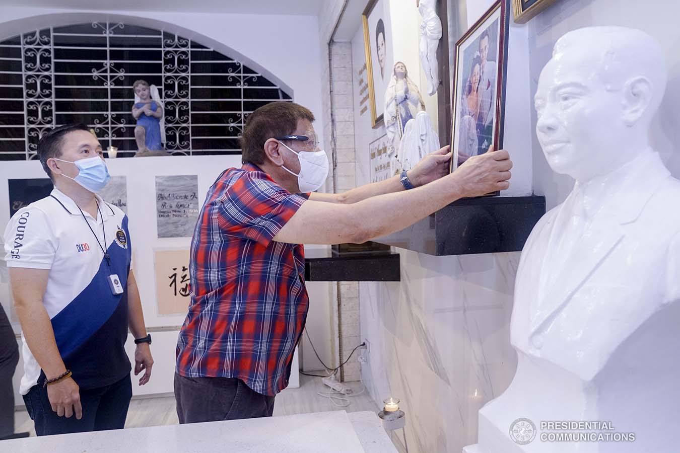 President Rodrigo Roa Duterte is accompanied by Senator Christopher "Bong" Go as he visits the resting place of his parents, Vicente Duterte, the former governor of then undivided Davao Province, and Soledad Duterte, one of Davao’s respected civic leaders, at the Roman Catholic Cemetery in Davao City on October 28, 2020. The President, as an annual tradition, visits the family mausoleum during All Saints or All Souls Day even when he was still mayor of Davao City. ARMAN BAYLON/ PRESIDENTIAL PHOTO
