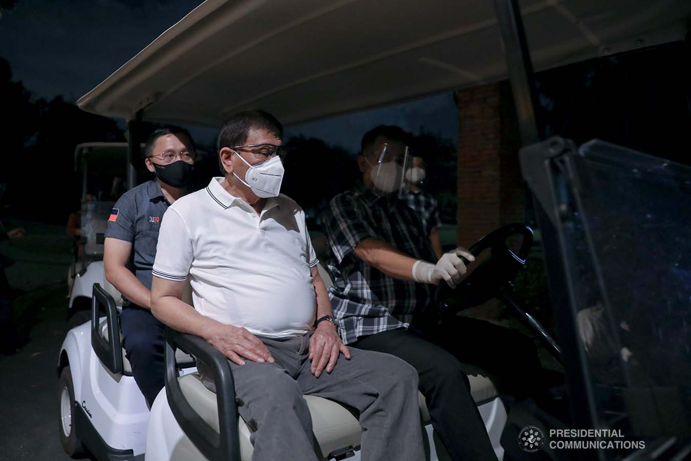 President Rodrigo Roa Duterte is accompanied by Senator Christopher Lawrence Go as they ride a golf cart heading to Malacañang Golf (Malago) Clubhouse in Malacañang Park, Manila on February 26, 2021. KARL NORMAN ALONZO/ PRESIDENTIAL PHOTO